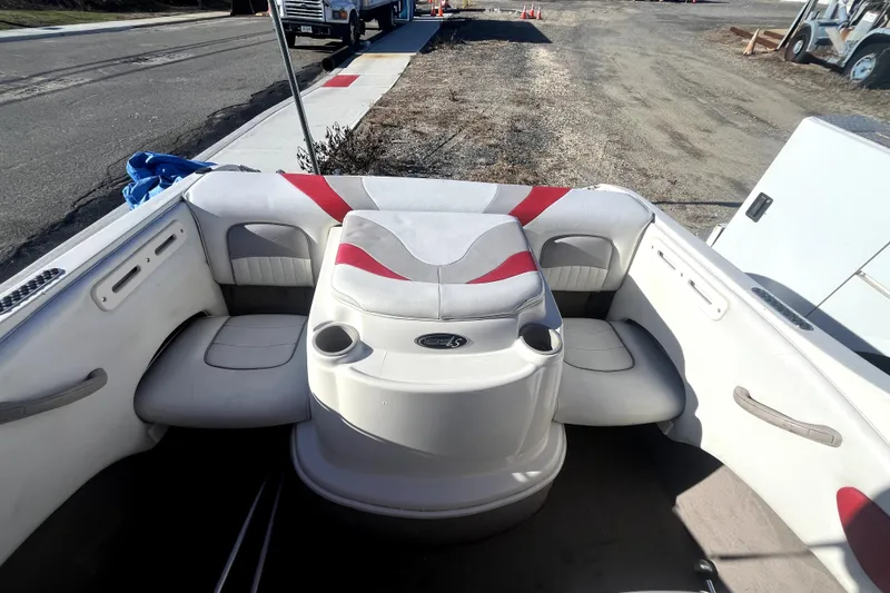 Slide: The Image of 2007 Stingray 185 LS/LX boat interior with white seating and dashboard. - 9