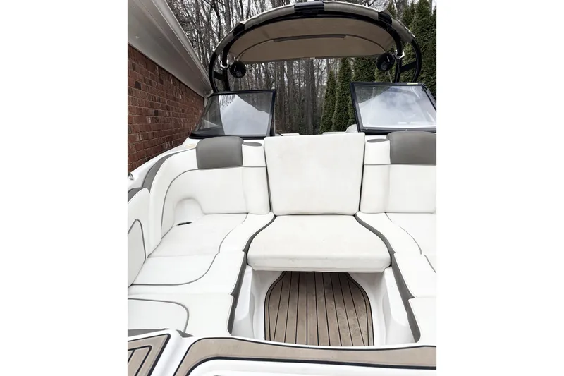 Slide: The Image of 2014 Yamaha Boats 242 Limited S interior with white seating and sleek design. - 5