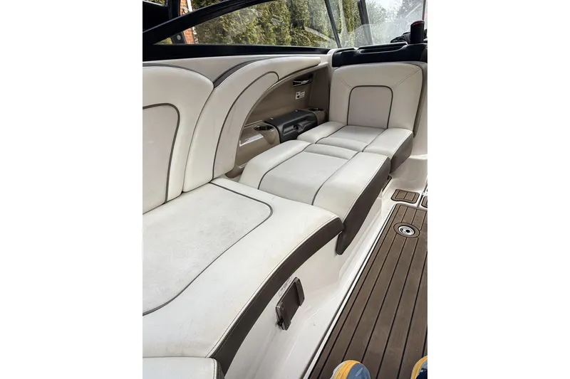 Slide: The Image of Interior seating of 2014 Yamaha Boats 242 Limited S, featuring white and gray upholstery. - 6