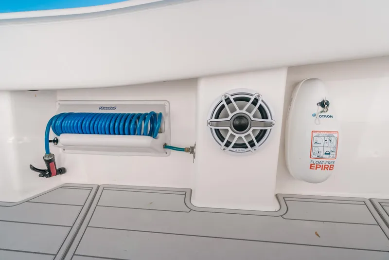Slide: The Image of 2016 Invincible 42 Open Fisherman boat features hose, speaker, and EPIRB safety device. - 11