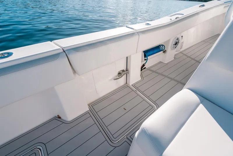 Slide: The Image of 2016 Invincible 42 Open Fisherman boat interior with sleek deck and seating. - 13