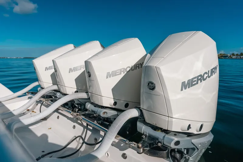 Slide: The Image of Four Mercury outboard engines on a 2016 Invincible 42 Open Fisherman boat. - 15