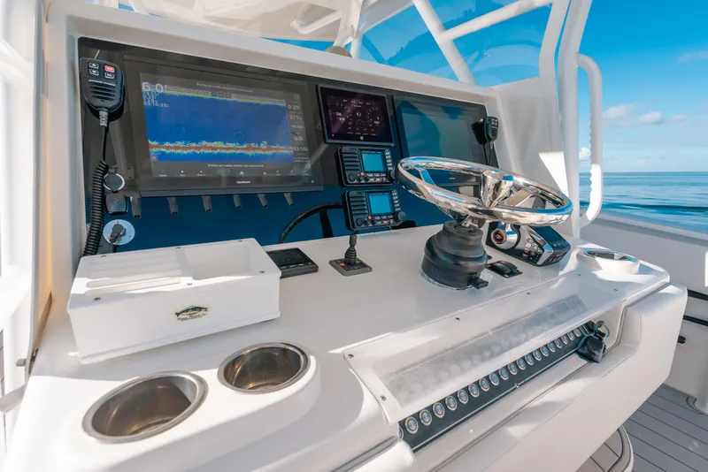 Slide: The Image of Control panel of a 2016 Invincible 42 Open Fisherman boat with navigation equipment. - 19