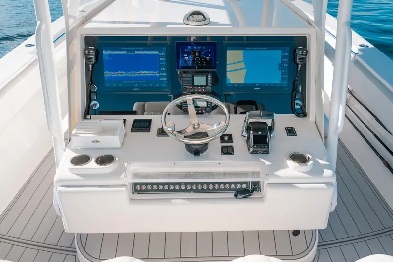 Slide: The Image of Control panel of 2016 Invincible 42 Open Fisherman boat with navigation screens. - 23