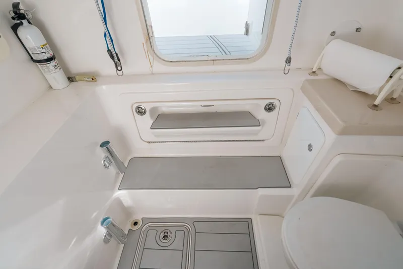 Slide: The Image of 2016 Invincible 42 Open Fisherman boat interior with storage and safety equipment. - 29