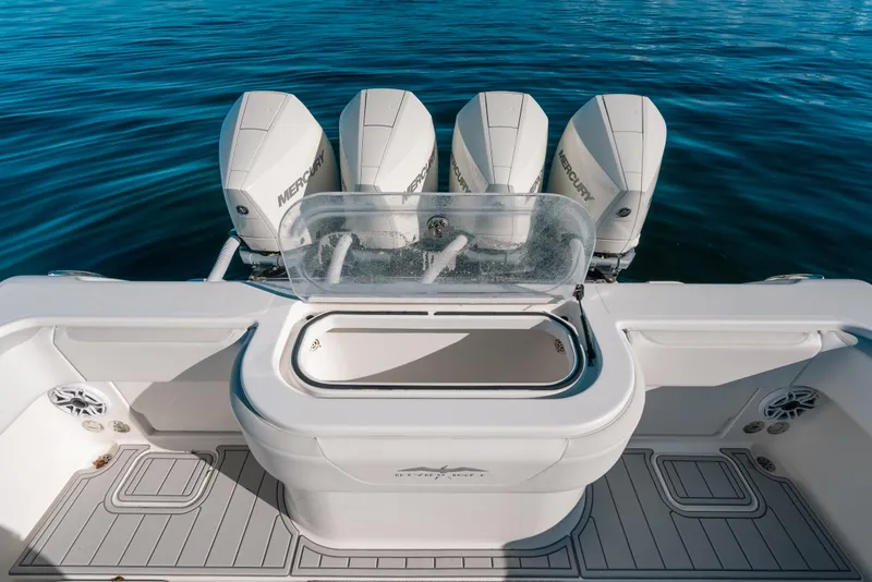 Slide: The Image of 2016 Invincible 42 Open Fisherman boat with four Mercury engines on calm water. - 37