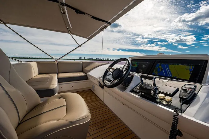 Slide: The Image of Luxurious 2016 Princess S65 yacht cockpit with leather seating and advanced navigation system. - 26