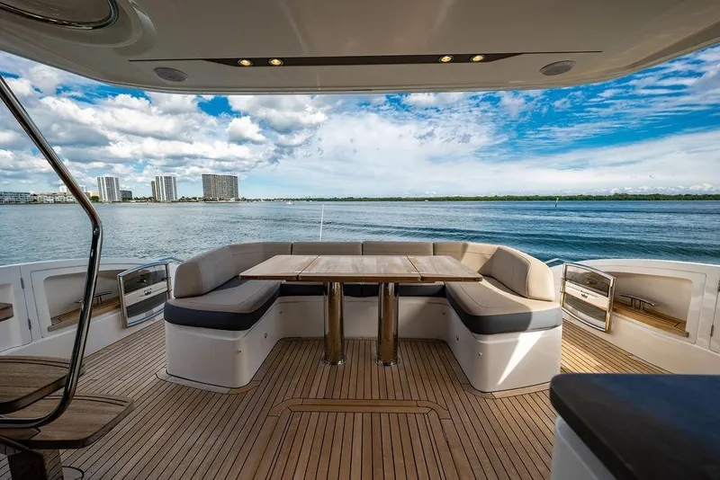 Slide: The Image of Luxurious 2016 Princess S65 yacht deck with elegant seating and scenic ocean view. - 30