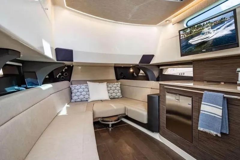 Slide: The Image of Luxurious interior of 2022 Boston Whaler 420 Outrage yacht with modern amenities and cozy seating. - 14