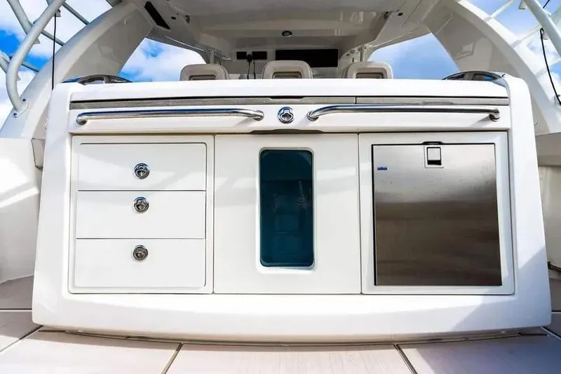 Slide: The Image of 2022 Boston Whaler 420 Outrage boat interior with storage and stainless steel features. - 20