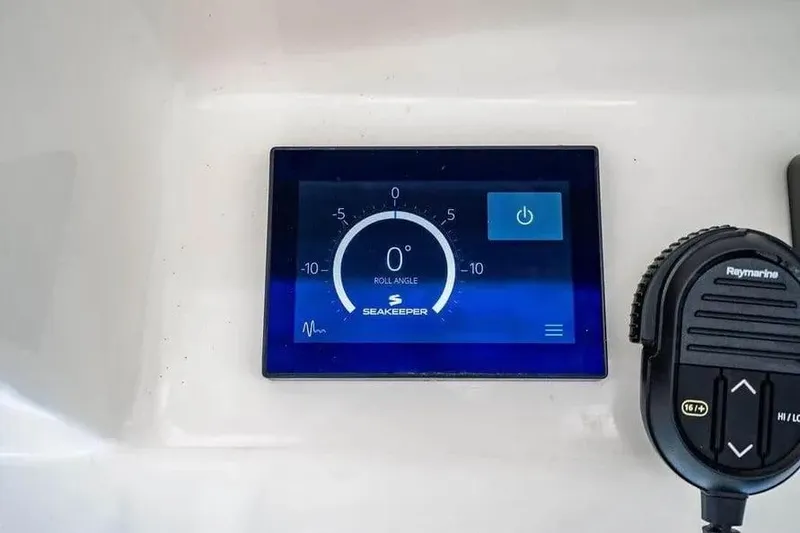 Slide: The Image of Seakeeper control panel on 2022 Boston Whaler 420 Outrage boat dashboard. - 30