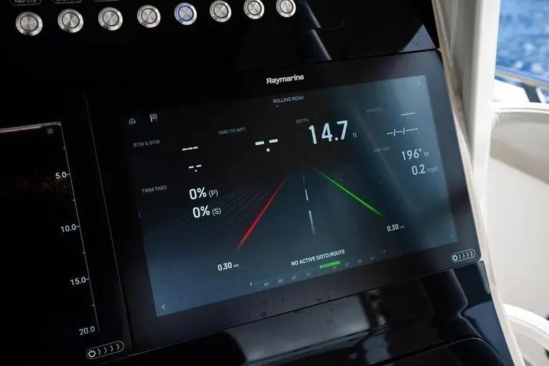 Slide: The Image of Dashboard of 2022 Boston Whaler 420 Outrage with Raymarine navigation display. - 32