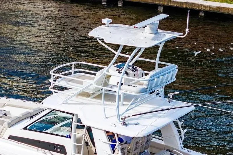 Slide: The Image of Boston Whaler 420 Outrage 2022 boat with elevated helm station on water. - 7
