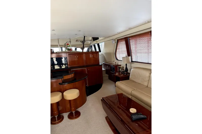 Slide: The Image of Luxurious interior of 2005 Carver 570 Voyager Pilothouse with seating and panoramic windows. - 2