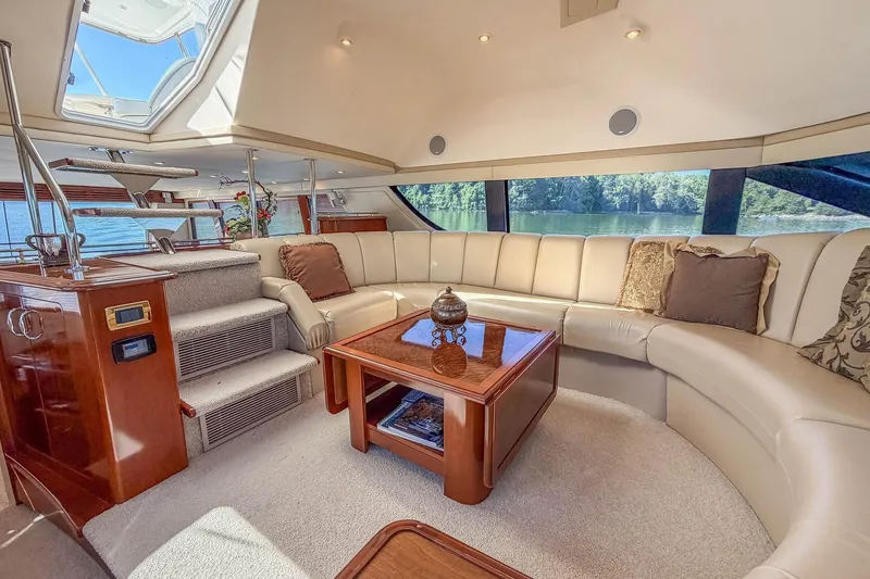 Slide: The Image of Luxurious interior of 2005 Carver 570 Voyager Pilothouse yacht with plush seating and elegant decor. - 26
