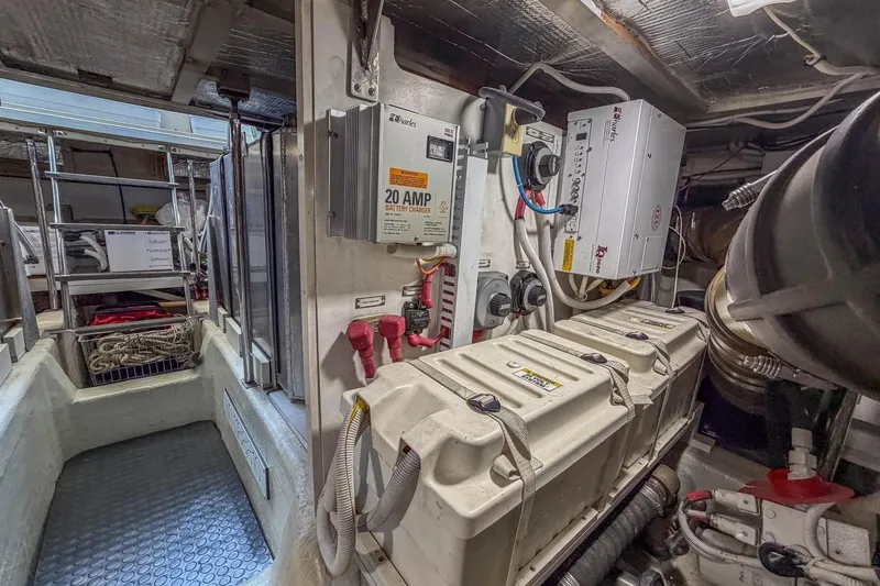 Slide: The Image of Engine room of 2005 Carver 570 Voyager Pilothouse with battery charger and equipment. - 49