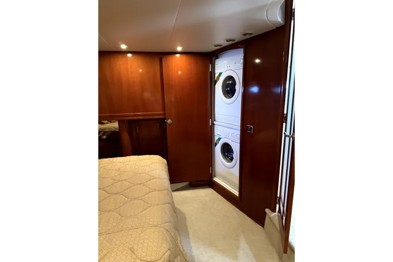 Slide: The Image of Luxurious interior of 2005 Carver 570 Voyager Pilothouse with elegant wood cabinetry. - 5