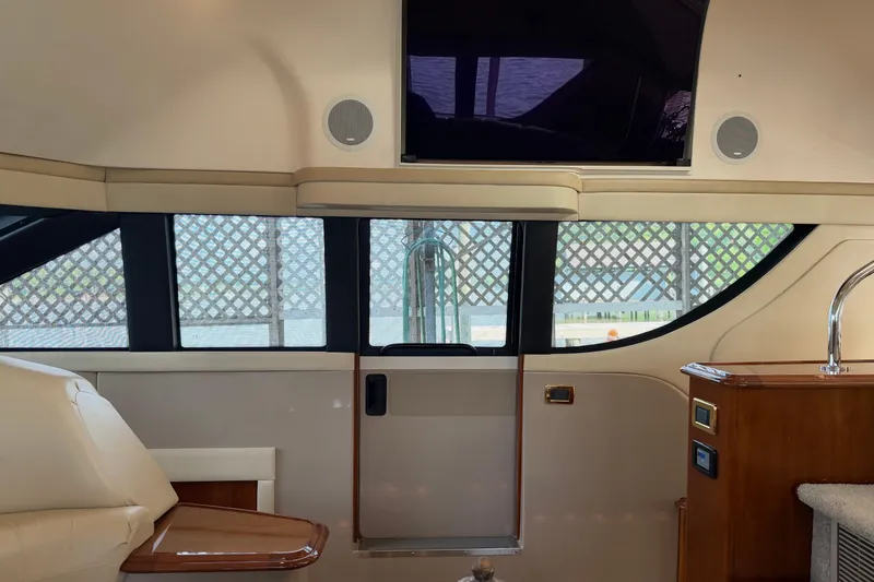 Slide: The Image of Interior of 2005 Carver 570 Voyager Pilothouse with modern design and large windows. - 8