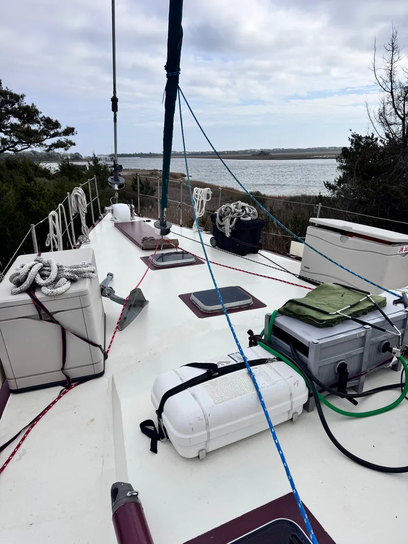 Slide: The Image of Deck of a 1999 Bruce Roberts 64 Custom Steel Cruiser with ropes and equipment. - 13