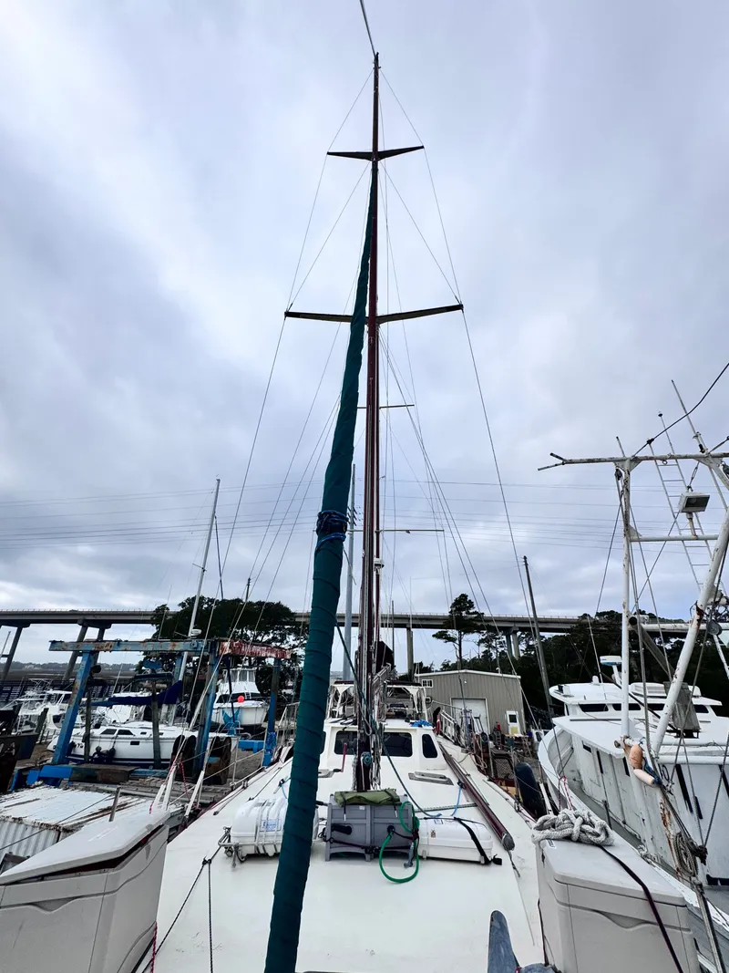 Slide: The Image of Bruce Roberts 64 Custom Steel Cruiser, 1999 model, docked in harbor. - 16