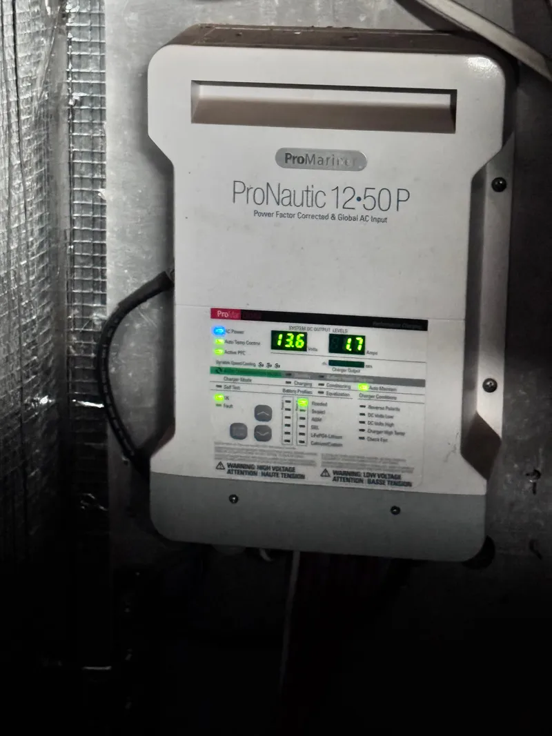 Slide: The Image of ProNautic 12:50 P charger aboard a 1999 Bruce Roberts cruiser. - 27