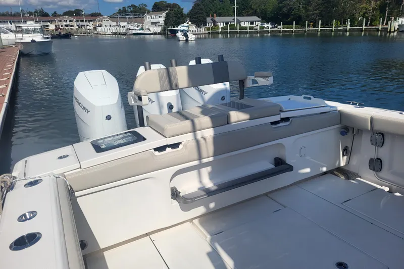 Slide: The Image of Solace 37 Pilot 2026 boat interior with Mercury engines at a marina. - 11