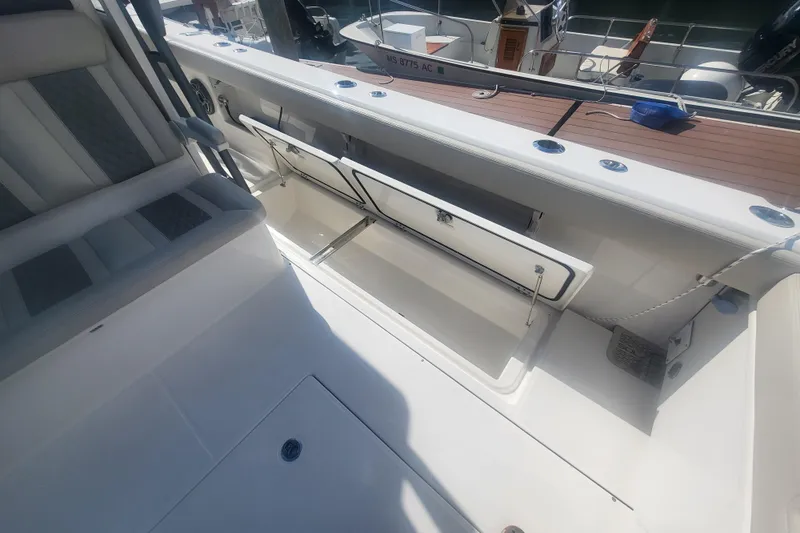 Slide: The Image of 2026 Solace 37 Pilot boat interior with open storage compartments. - 13