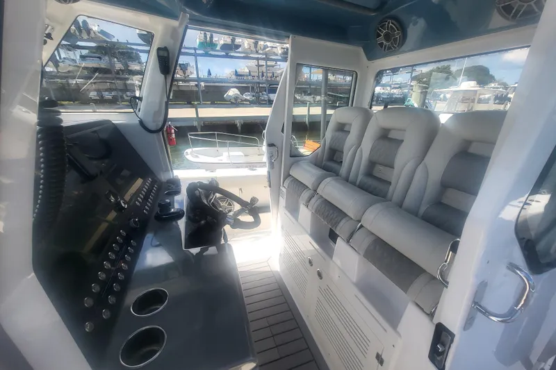 Slide: The Image of Interior of 2026 Solace 37 Pilot boat with modern seating and control panel. - 27