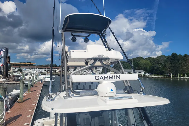 Slide: The Image of 2026 Solace 37 Pilot boat with Garmin equipment docked under a blue sky. - 28