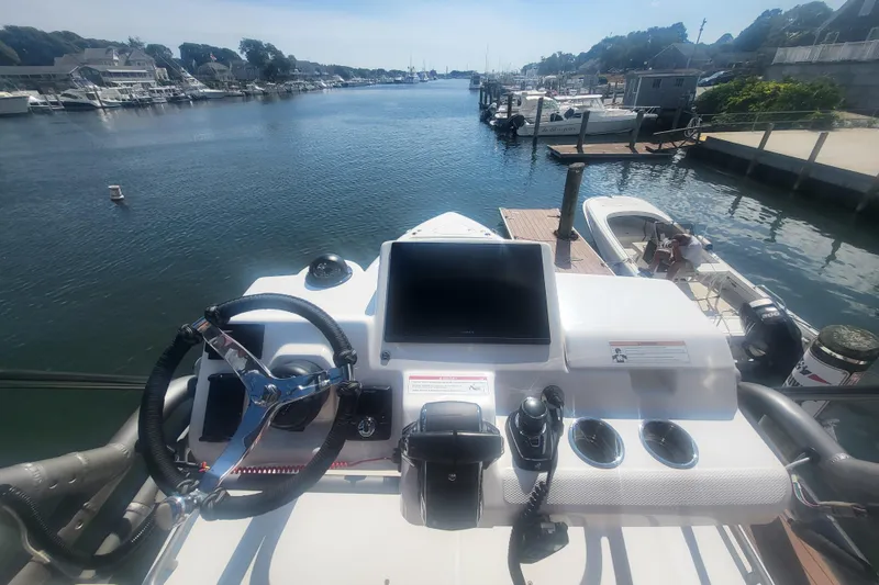 Slide: The Image of Helm of 2026 Solace 37 Pilot boat docked in a marina, featuring modern controls. - 6