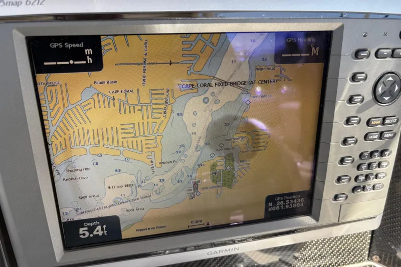 Slide: The Image of Garmin GPS map display on 2012 Nor-Tech 340 Sport Center Console boat, showing Cape Coral area. - 15