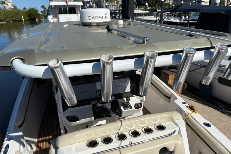 Slide: The Image of 2012 Nor-Tech 340 Sport Center Console boat with Garmin equipment and rod holders. - 20