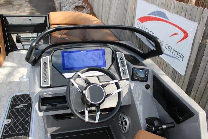 Slide: The Image of 2026 Starcraft RX 23 Q DH boat dashboard with modern controls and navigation display. - 11