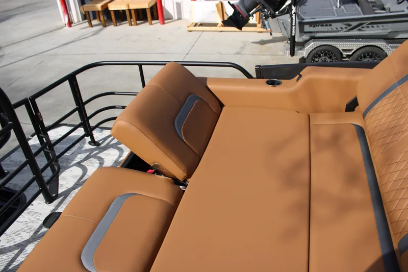 Slide: The Image of Luxurious tan seating on 2026 Starcraft RX 23 Q DH boat, featuring sleek design and comfort. - 16