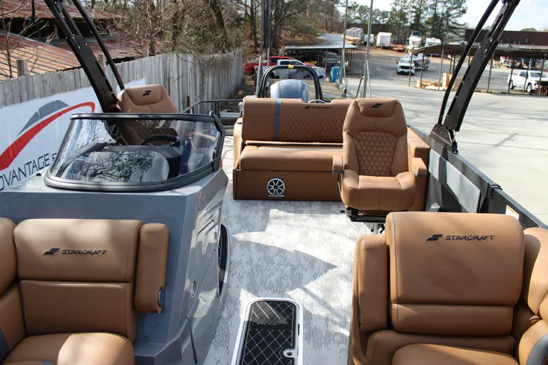 Slide: The Image of 2026 Starcraft RX 23 Q DH boat with luxurious tan seating and modern design. - 6