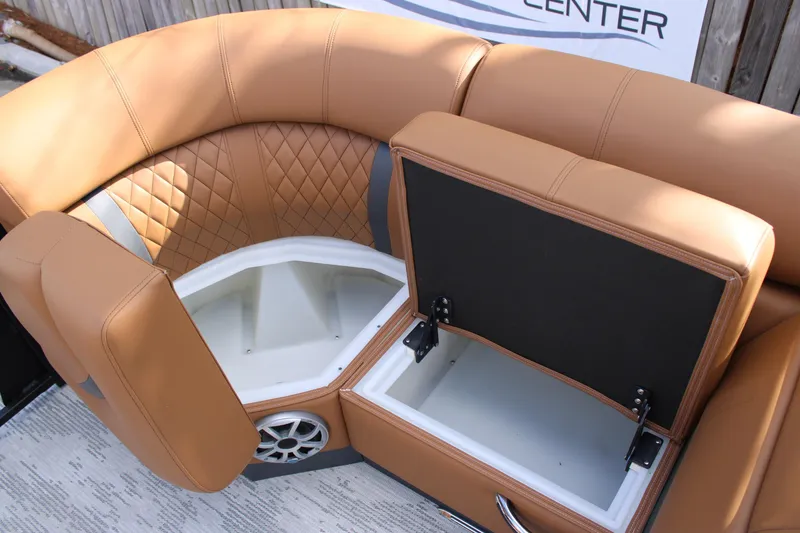 Slide: The Image of 2026 Starcraft RX 23 Q DH boat seating with storage compartments and speaker. - 8