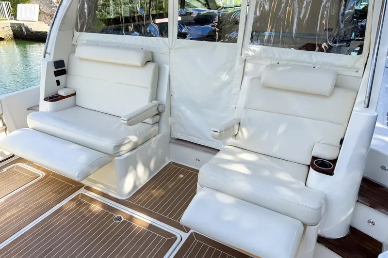 Slide: The Image of 2021 Hinckley Sport Boats 40x with luxurious seating and sleek design on a sunny day. - 11