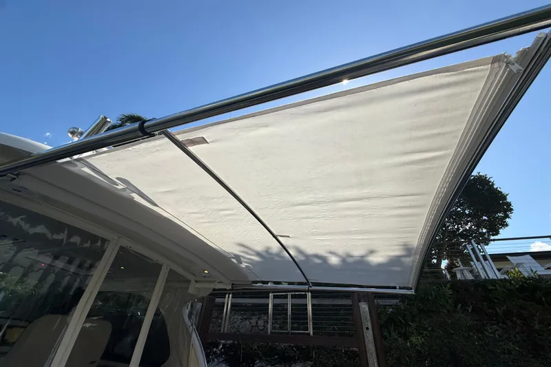 Slide: The Image of Hinckley Sport Boats 40x, 2021, seating area with table and engines. - 14