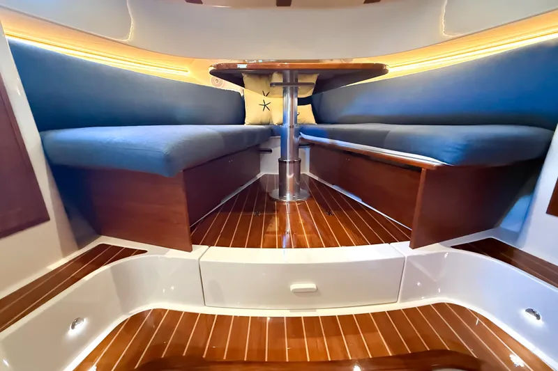 Slide: The Image of Interior of 2021 Hinckley Sport Boats 40x, featuring wood cabinetry and modern amenities. - 18