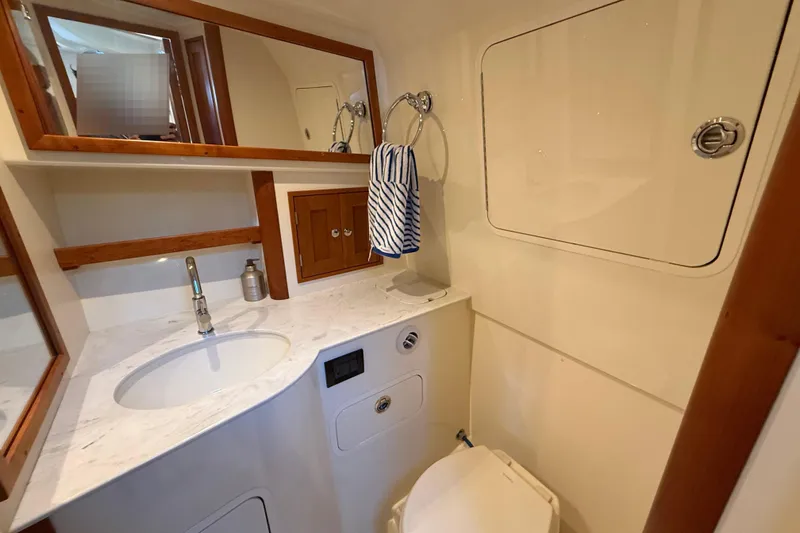 Slide: The Image of Luxurious cabin interior of 2021 Hinckley Sport Boats 40x with comfortable bedding. - 21