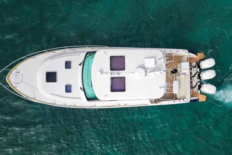 Slide: The Image of Top view of 2021 Hinckley Sport Boats 40x on clear turquoise water. - 4
