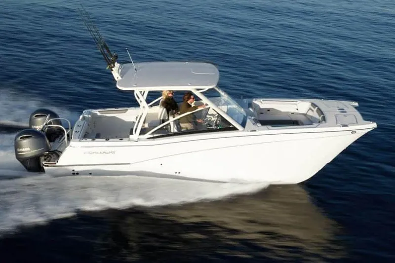 Slide: The Image of Manufacturer Provided Image: 2026 World Cat 280 DC-X cruising on open water, showcasing sleek design and powerful engines. - 2