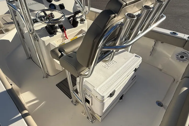 Slide: The Image of 2023 Key West 203 FS boat interior with steering console and seating. - 10