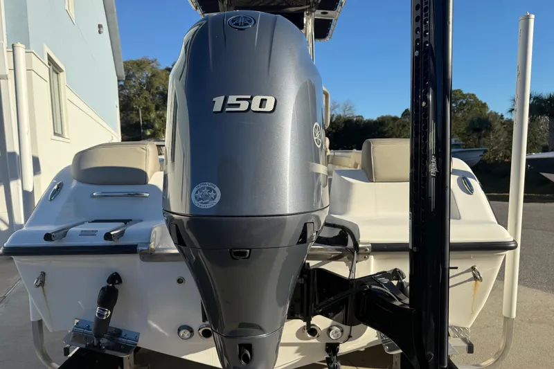 Slide: The Image of 2023 Key West 203 FS boat with Yamaha 150 outboard motor, rear view. - 11