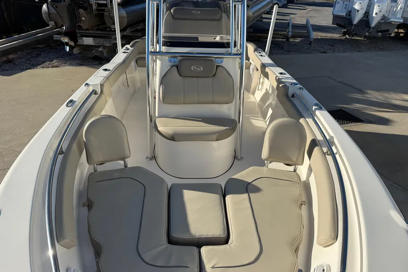 Slide: The Image of 2023 Key West 203 FS boat interior with beige seating and stainless steel railings. - 5