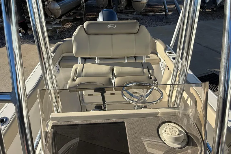 Slide: The Image of 2023 Key West 203 FS boat interior with steering wheel and seating. - 7