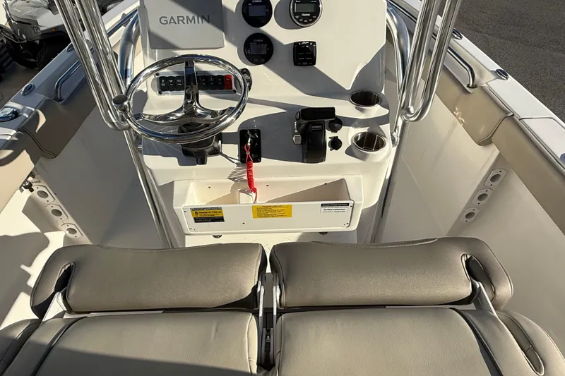 Slide: The Image of 2023 Key West 203 FS boat console with Garmin navigation and dual seating. - 8