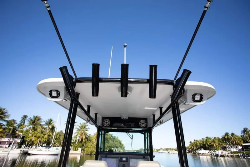 Slide: The Image of 2026 World Cat 325 CC boat interior with luxurious seating on a sunny day. - 17