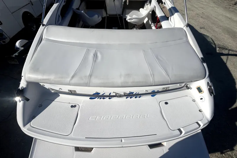 Slide: The Image of Rear view of a 2002 Chaparral 216 SSi boat with seating area. - 12