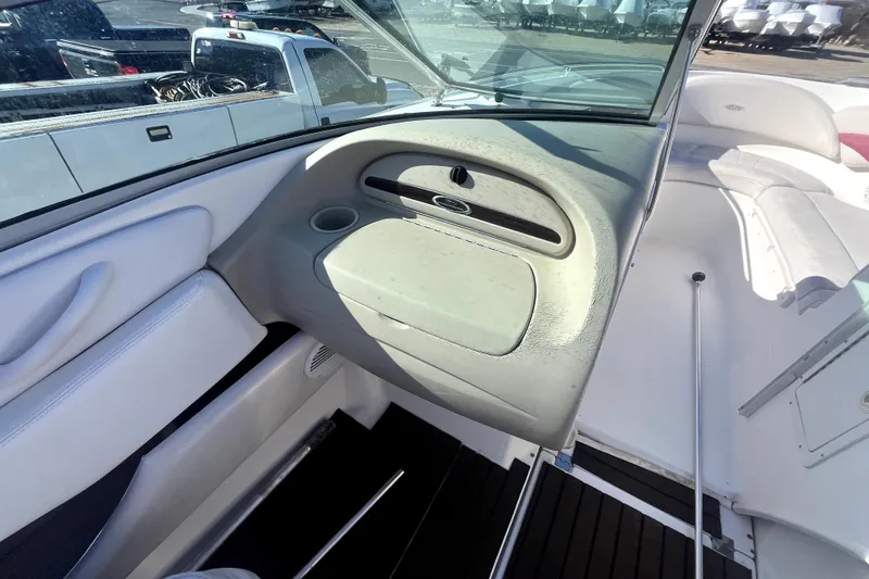 Slide: The Image of Interior view of 2002 Chaparral 216 SSi boat, featuring dashboard and seating area. - 5